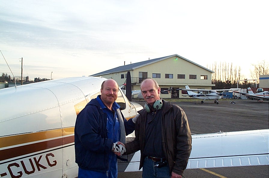 Alan March receives contratulations form Chief Flying Instructor David Parry after the completion of Alan's First Solo Flight on December 8, 2007.  Langley Flying School.