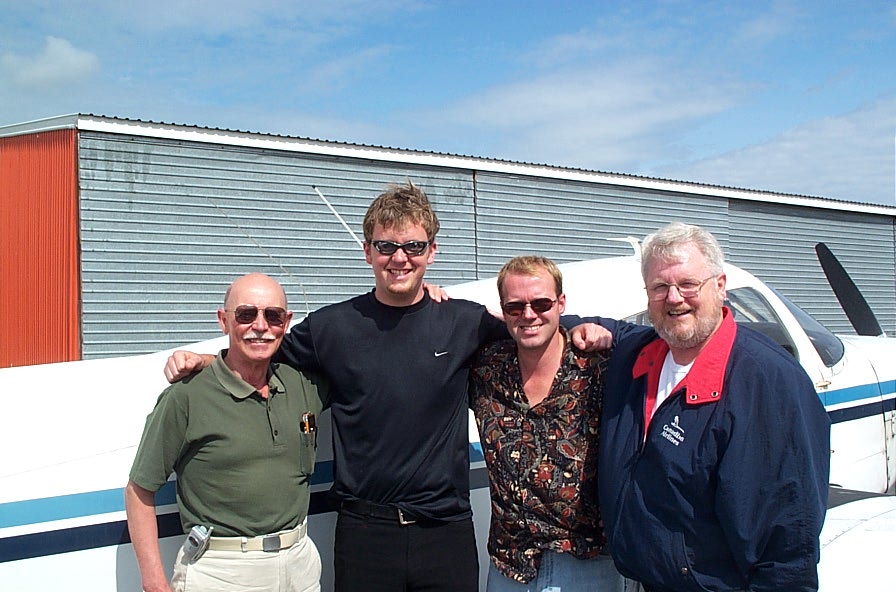 Commercial Pilot Cullen Worth (second from left) with (left to right) Pilot Examiner Donn Richardson, Flight Instructor David Woollam, and Cullen's Father, Brian Worth (retired Canadian Navy and Air Canada pilot).  Langley Flying School.