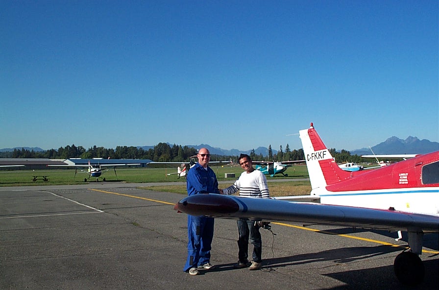 Private Pilot Student Ishan Patel with Flight Instructor Rod Giesbrecht after completing his First Solo Flight on September 22, 2009.  Langley Flying School.