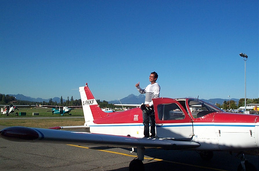 Ishan Patel on the wing of Cherokee FKKF after completing his First Solo Flight on September 22, 2009.  Langley Flying School.