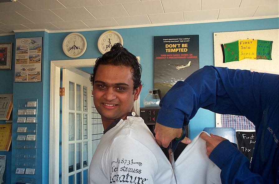 Ishan Patel is tagged (tag removed from his shirt) after completing his First Solo Flight on September 22, 2009.  Langley Flying School.