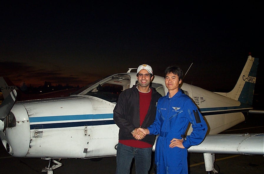 Karn Takkhar with Flight Instructor Hoowan Nam after the completion of Karn's First Solo Flight in Cherokee GNIC on November 4, 2007.  Langley Flying School
