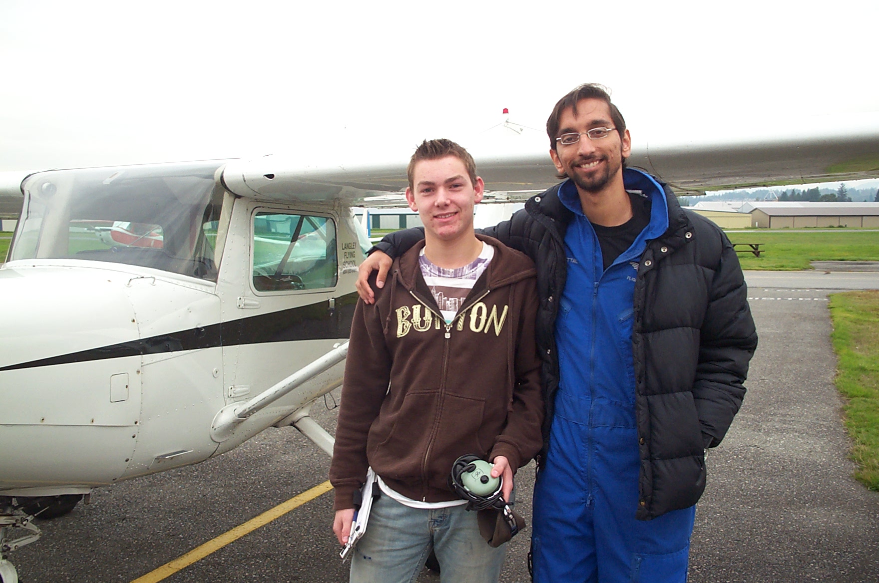 Kyle Rempel with his Flight Instructor, Mayank Mittal, after the completion of his First Solo Flight in Cessna 152 GPUK on October 18, 2010.  Langley Flying School.