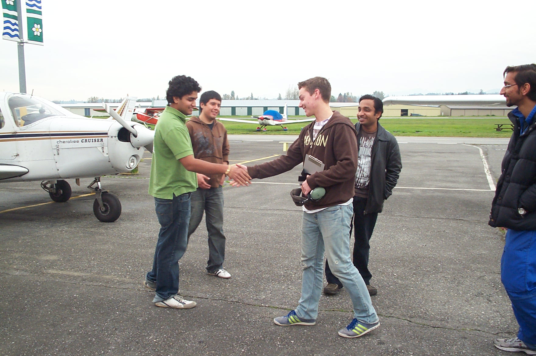 Kyle Rempel congratuled by fellow students following his First Solo Flight, October 18, 2010.