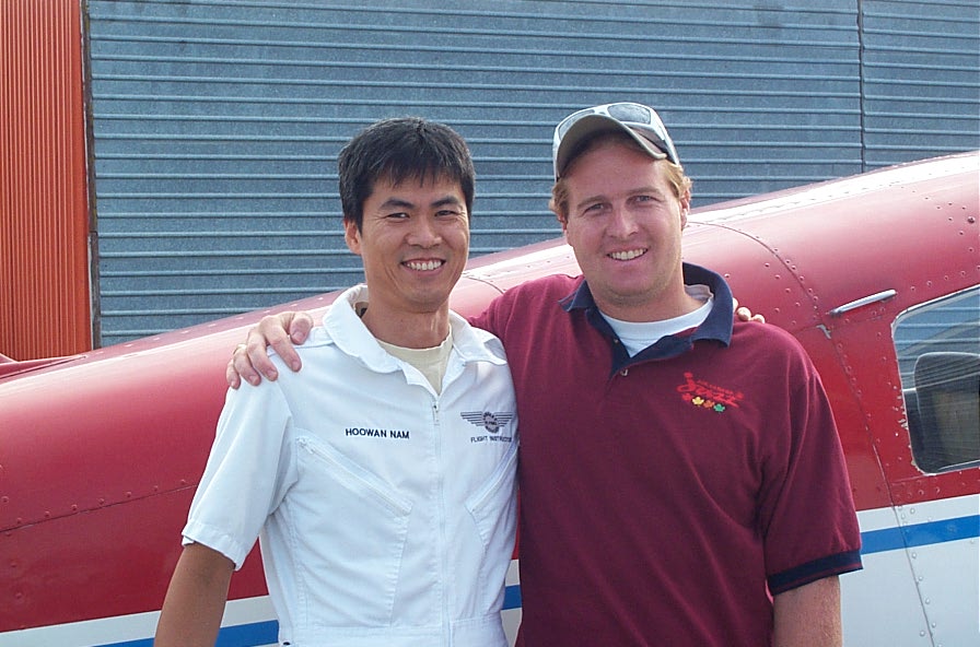 Matt Lusty with his Flight Instructor, Hoowan Nam, after the completion of Matt's First Solo Flight on August 22, 2008.  Langley Flying School.