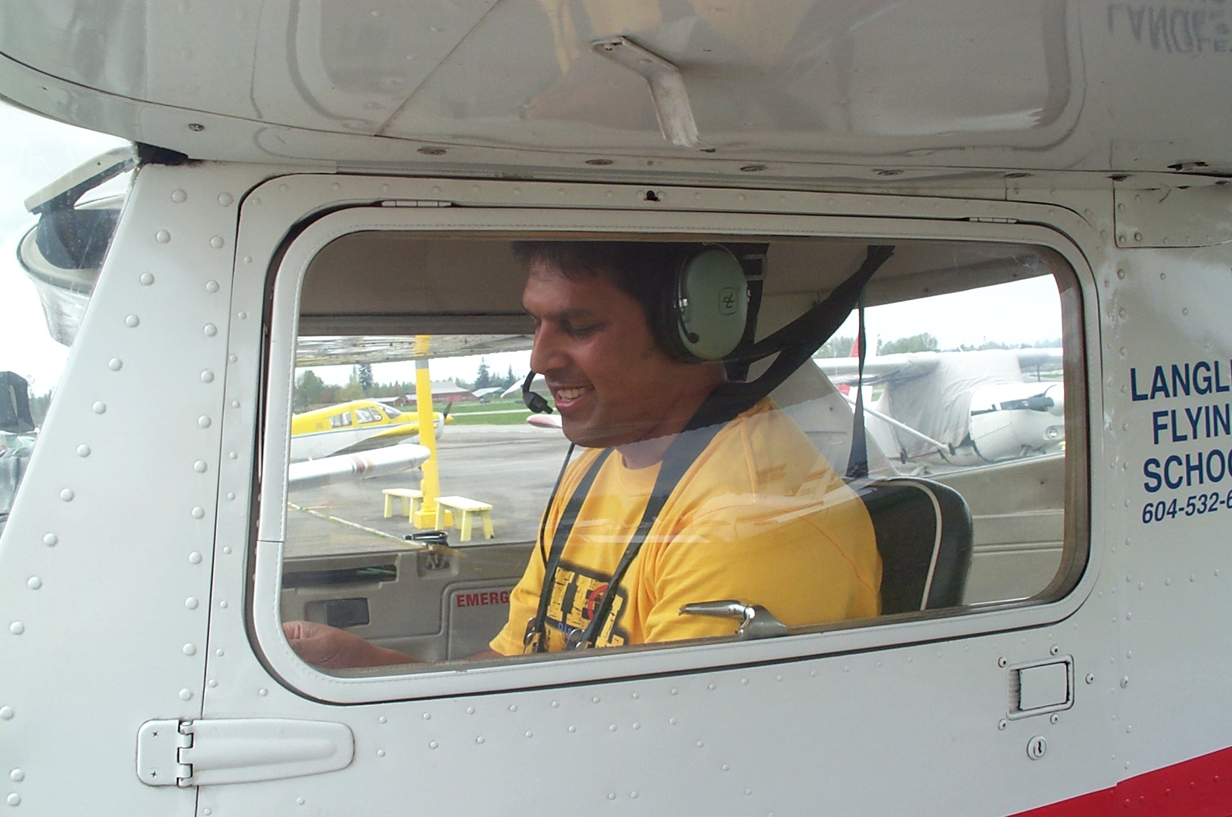 Michael Fernando in the cockpit of Cessna FPRT after the completion of his First Solo Flight on April 23, 2010.  Langley Flying School.