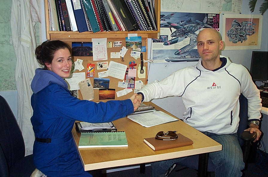 Naomi Jones receives congratulations from Pilot Examiner Todd Pezer after the successful completion of the qualifying Flight Test for Naomi's Group 1 (Multi-engine) Instrument Rating on February 15, 2010.