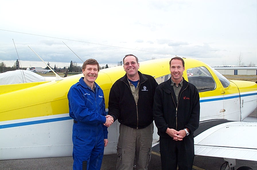 Richard Brooks receives congratulations from Flight Instructor Peter Waddington and Pilot Examiner Jeff Durrand after the successful completion of Richard's Private Pilot Flight Test on January 15, 2008.  Langley Flying School.
