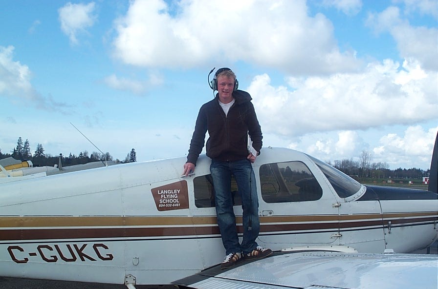 Ryan Kavanagh on the wing of Cherokee GUKG after the completion of his First Solo Flight.  Langley Flying School.