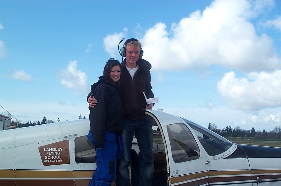 Ryan Kavanagh receives contratulations from his Flight Instructor, Naomi Jones, after the completion of Ryan's First Solo Flight.  Langley Flying School.