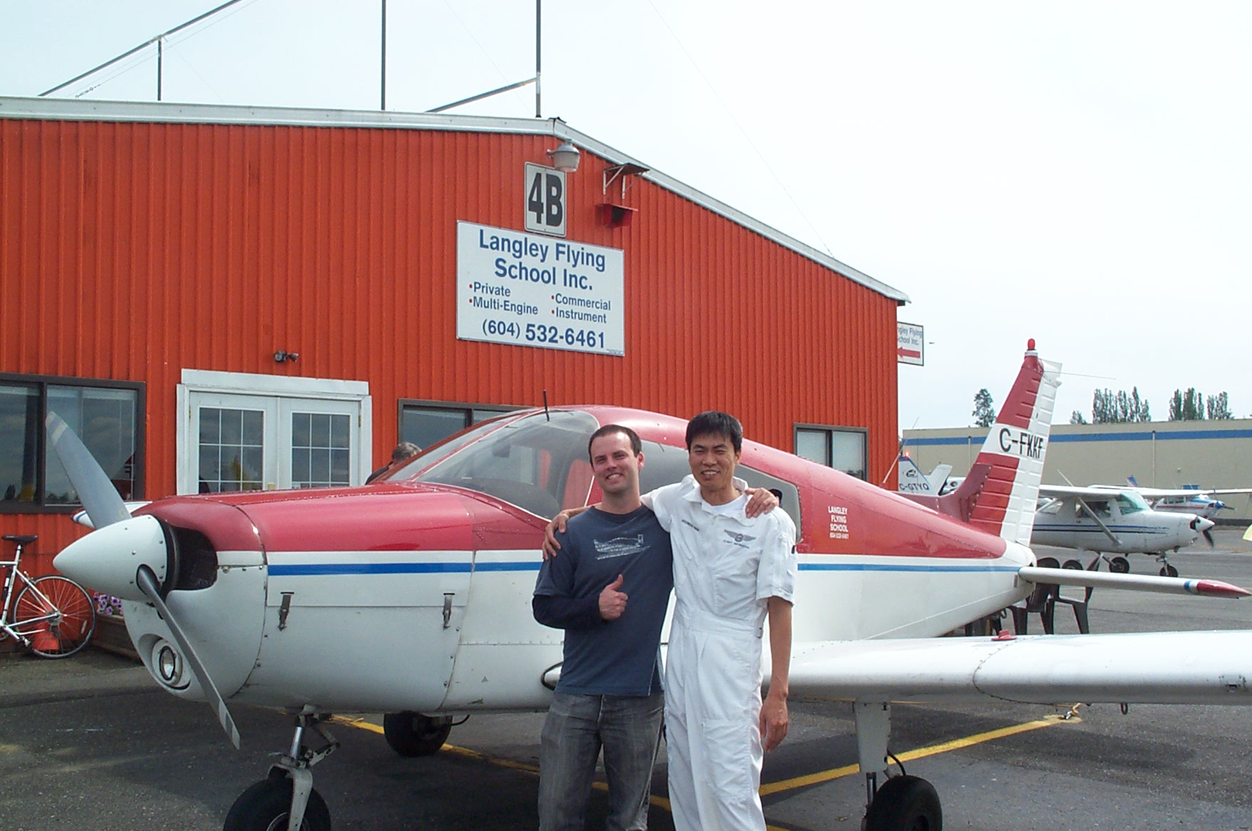 Zenon Garnett with his Flight Instructor, Hoowan Nam, after the successfrul completion of Zen's Commercial Pilot Flight Test with Pilot Examiner Paul Harris on June 30, 2010. Congrats to both of you! Langley Flying School.